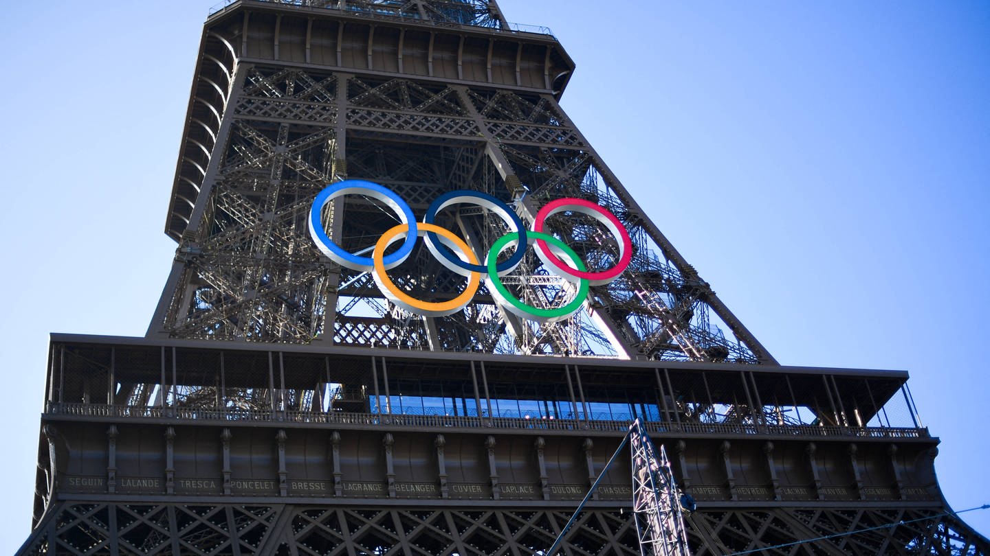 The five olympic rings have been hung on the Eiffel Tower in Paris.
