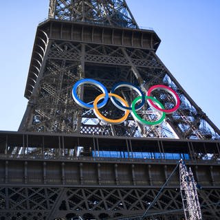 The five olympic rings have been hung on the Eiffel Tower in Paris.