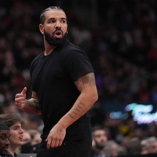 Drake reacts to a foul call during second half NBA first round playoff action between the the Toronto Raptors and Philadelphia 76ers in Toronto.