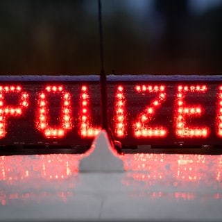 Polizei Schriftzug auf Auto.